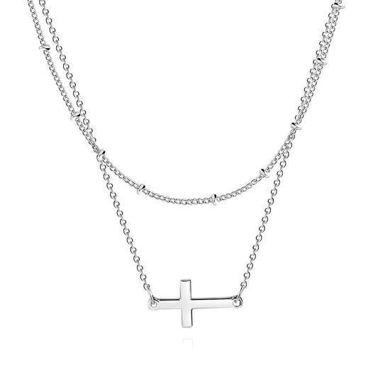 Silver cross necklaces, double layer on a white background