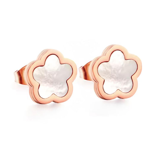 Rose gold flower-shaped earrings with white centers on a white background
