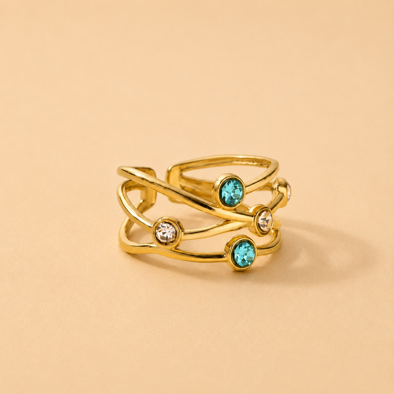 Gold open band ring featuring turquoise and clear crystal accents