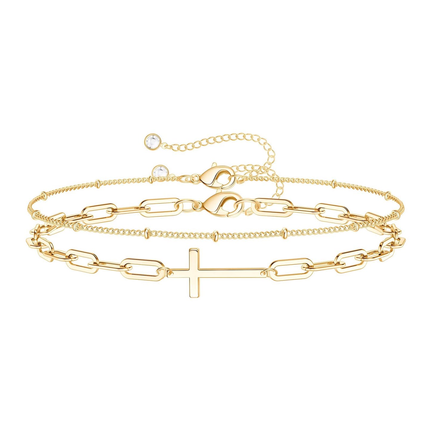 18K gold bracelet set with cross charm displayed on a neutral fabric background – Drawn Bracelet Set by 31:10 Jewelry