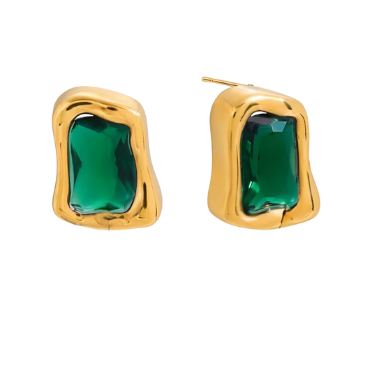 Gold earrings with green gemstones on a white background