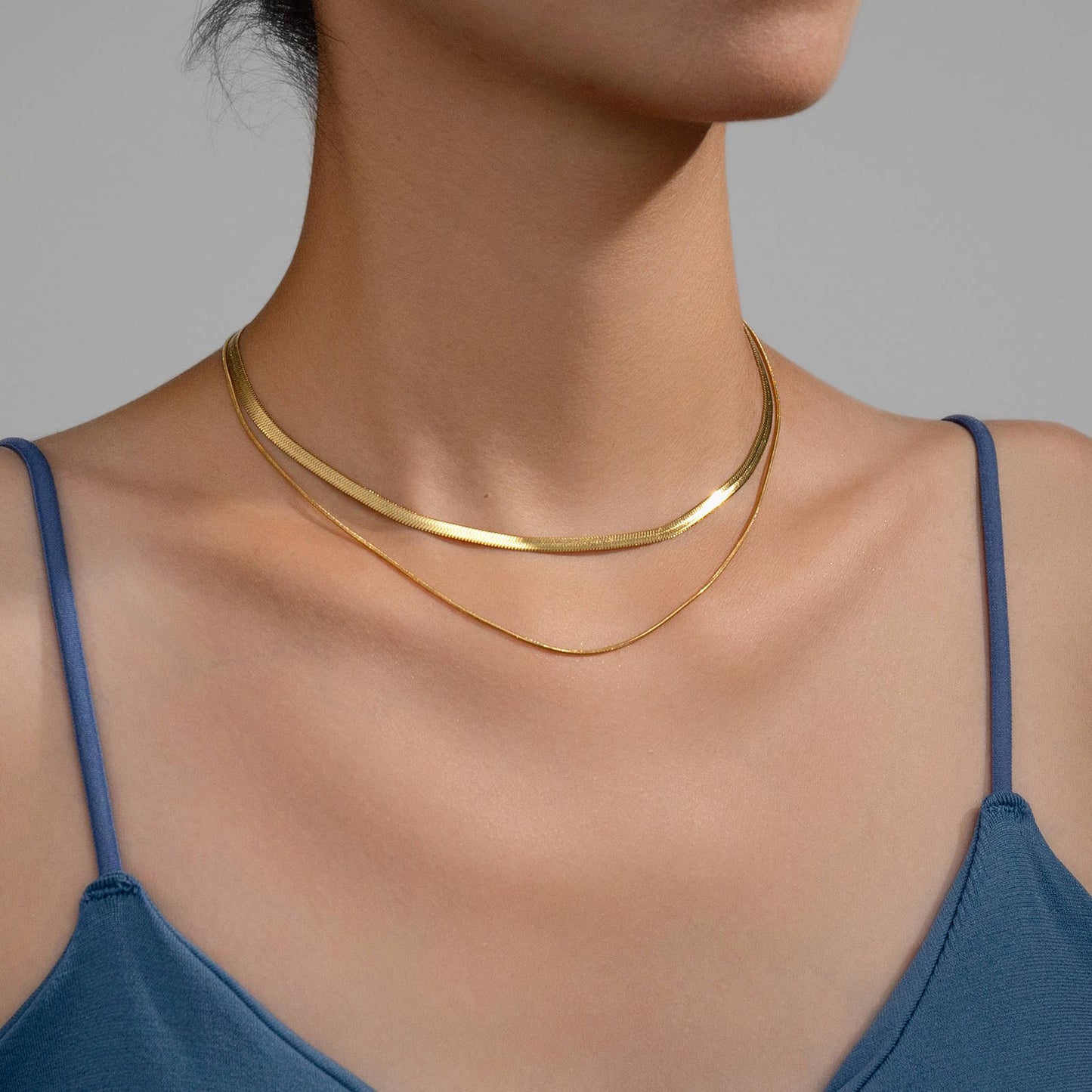layered gold necklace with sleek double strands in warm gold tones.