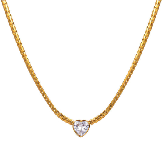 Gold necklace with heart-shaped pendant on model, symbolizing grace and inner light
