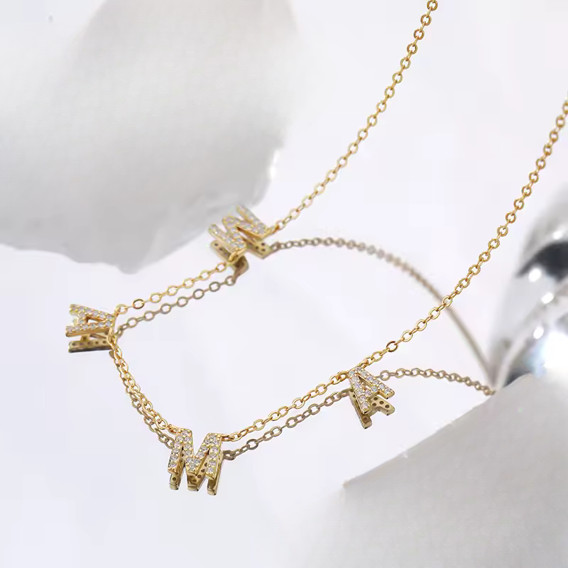 Gold mama necklace with rhinestone letters on a delicate chain