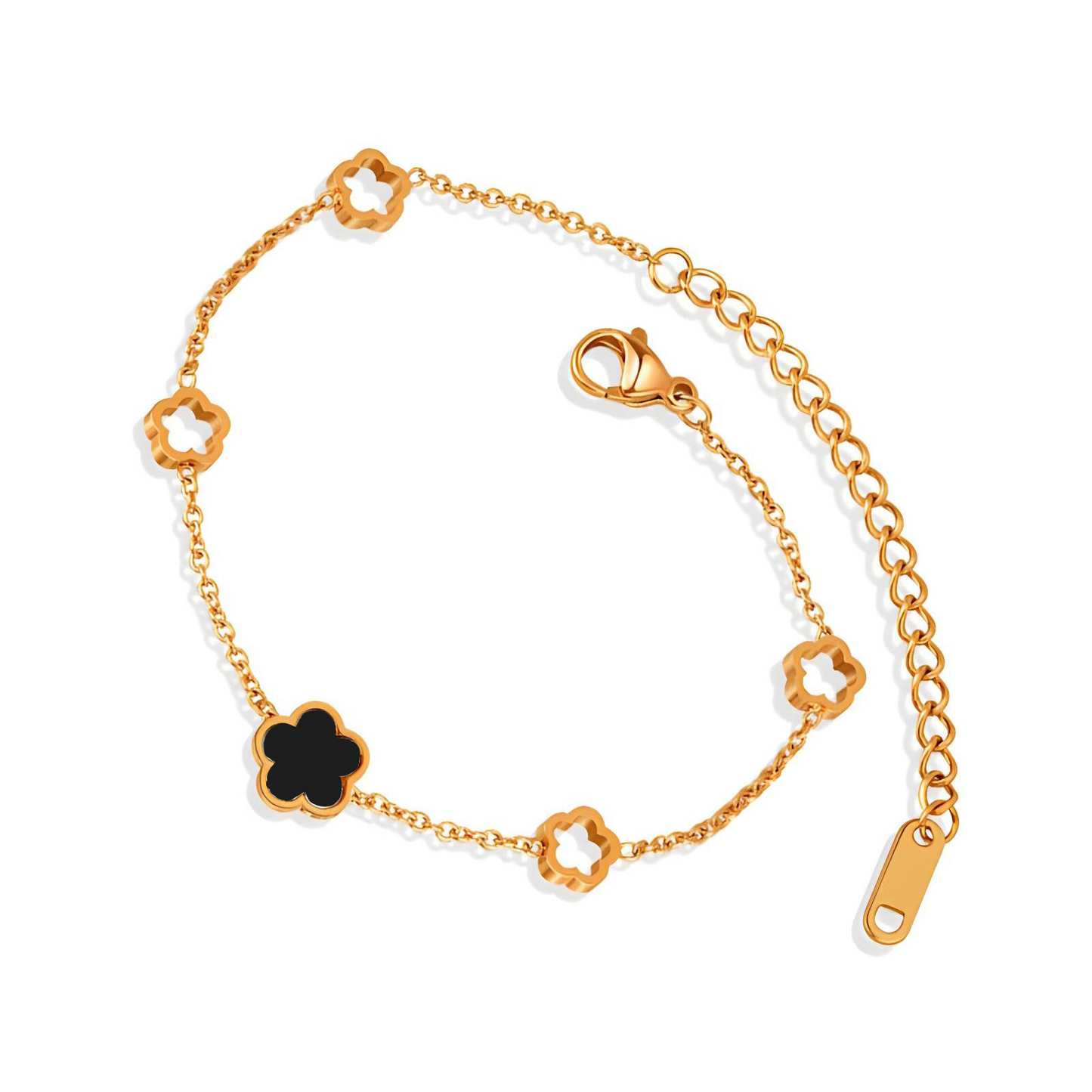Gold bracelet with black and white reversible clover-shaped charms on a white background