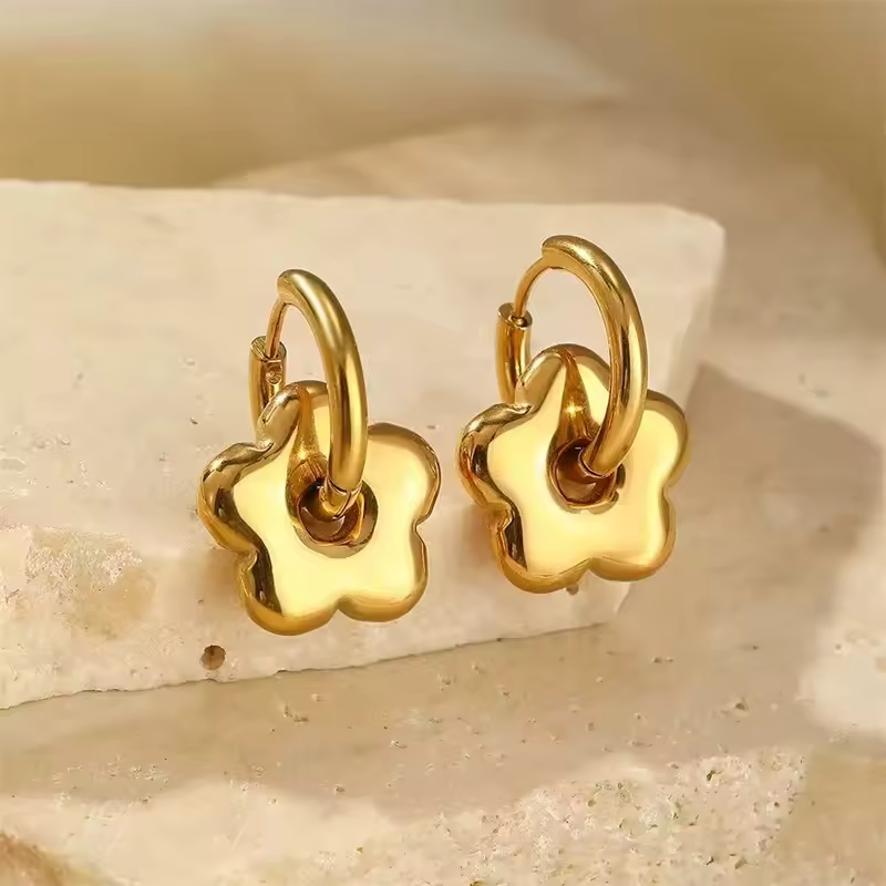 gold flower hoop earrings with small dainty floral charm minimalist everyday hoops
