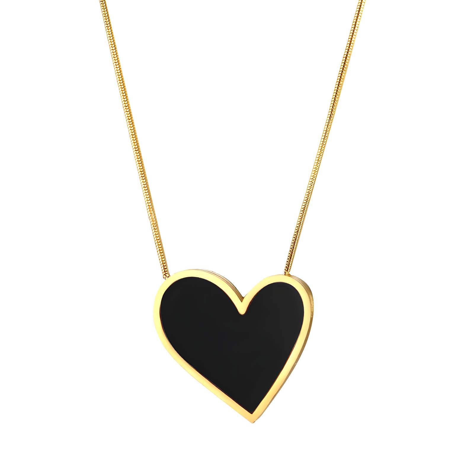 Heart-shaped black pendant on a gold chain against a white background