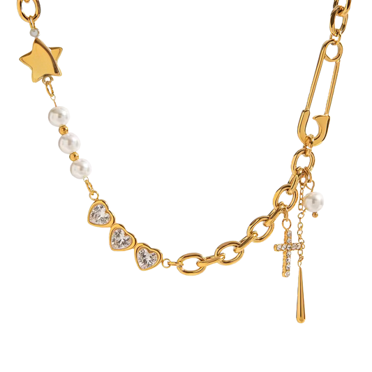 Gold necklace with various charms including a star, heart, and cross on a white background
