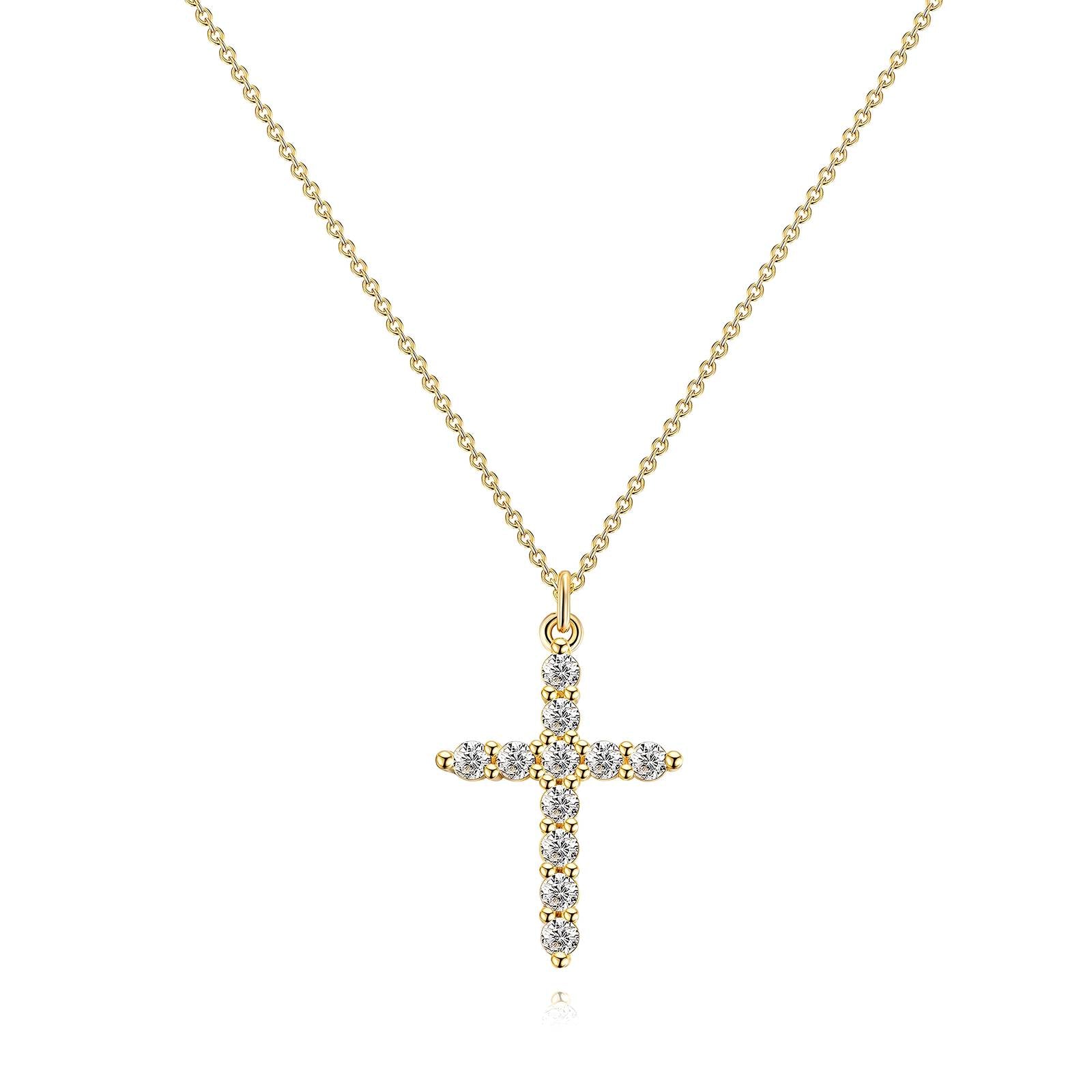 Gold cross necklace with diamonds on a white background