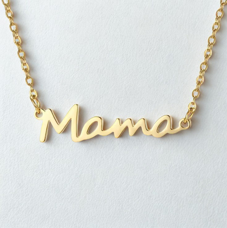 Gold 'Mama' necklace on a light gray background