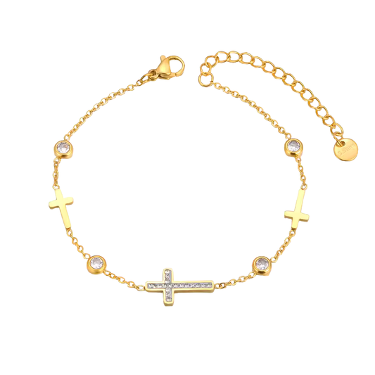 Gold bracelet with cross designs on a white background