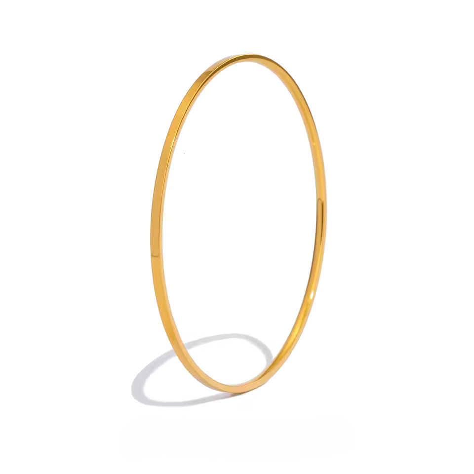 ultra-thin polished gold bangle in a seamless minimalist circle design.