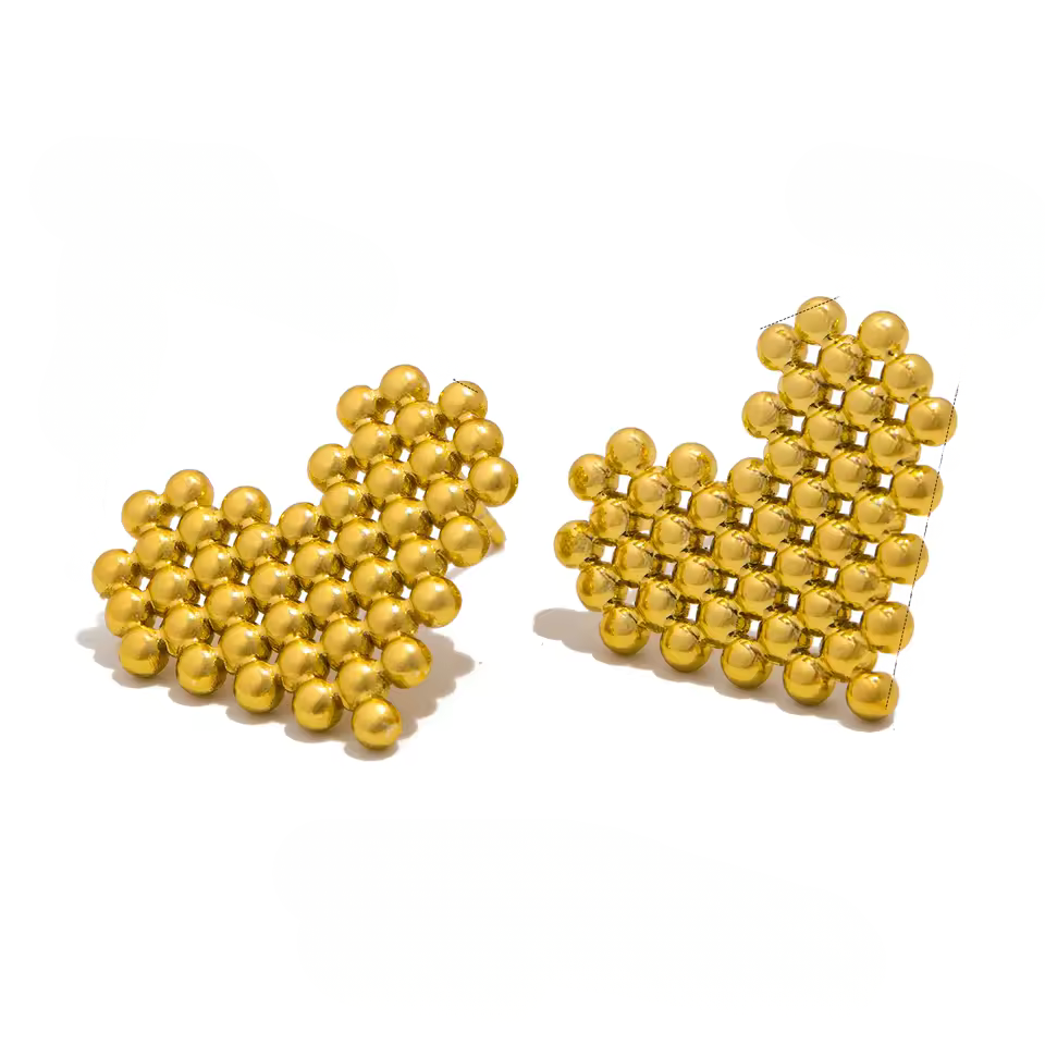 Gold heart-shaped earrings on a white background