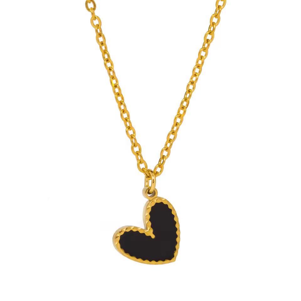 tilted small black heart pendant on gold chain