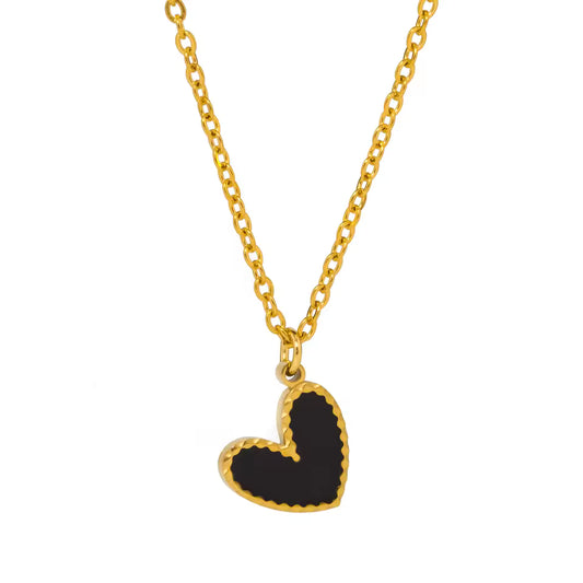 tilted small black heart pendant on gold chain