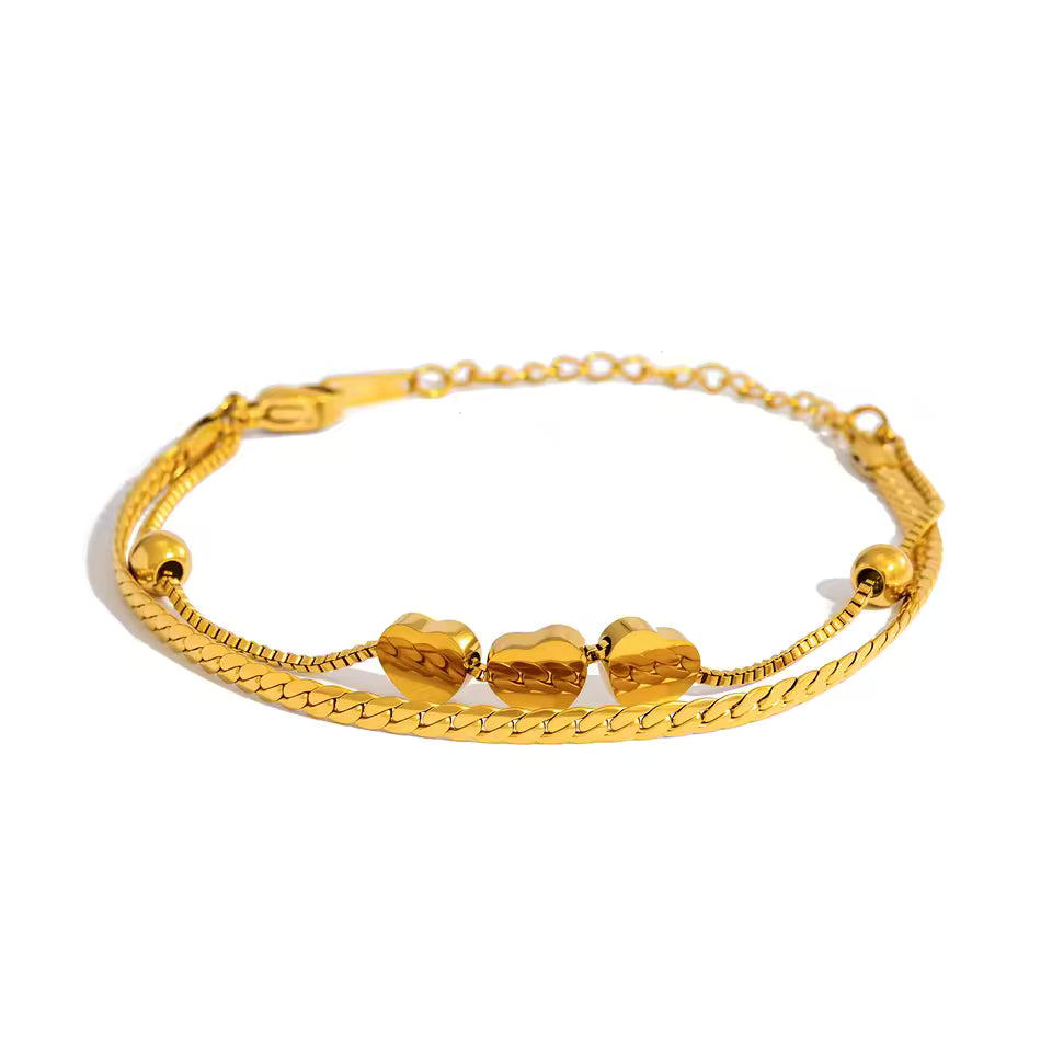 Linked Heart layered gold necklace with polished heart accents