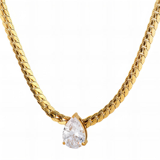 Gold necklace with a pear-shaped diamond pendant on a white background