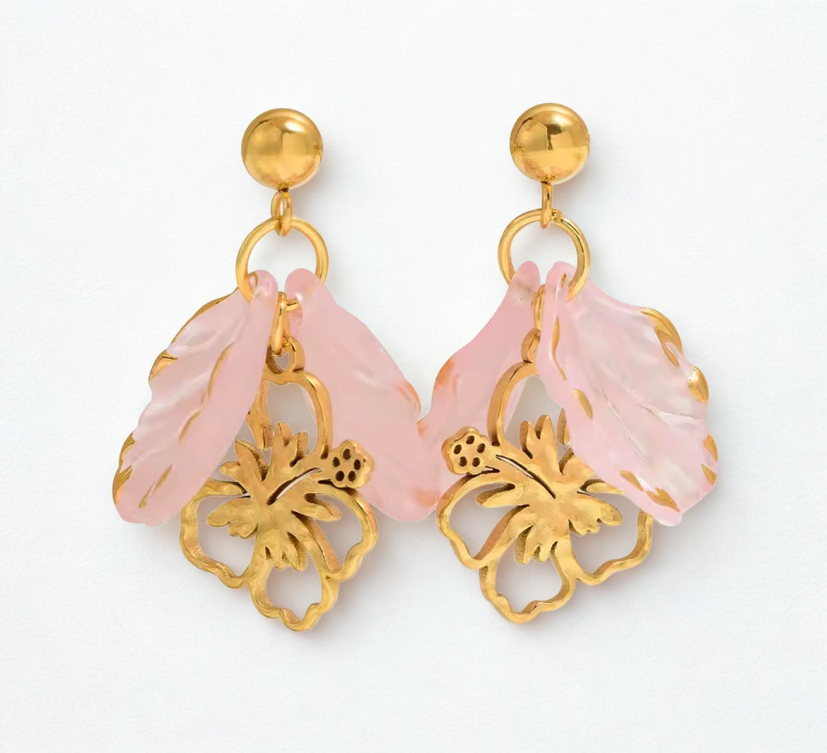 Pair of earrings with pink floral designs and gold accents.Pink flower statement earrings with gold accents and tropical floral design.
