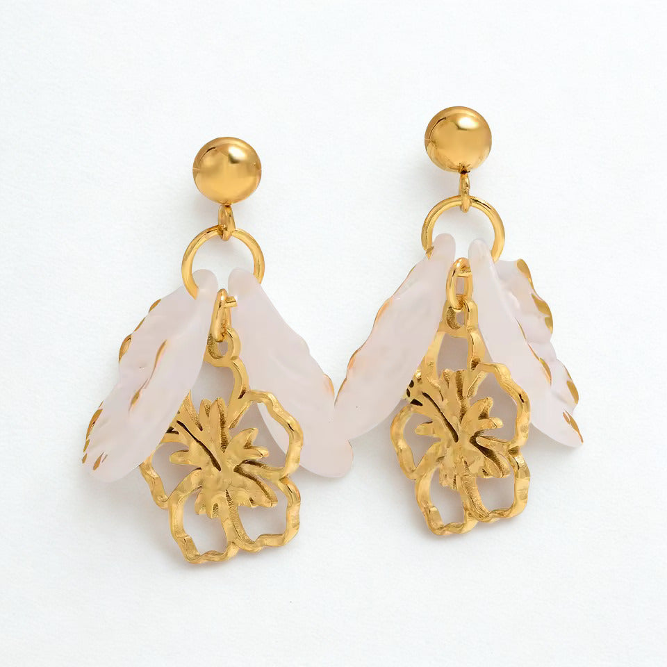 Gold and white earrings. White flower statement earrings with gold accents and tropical floral design.