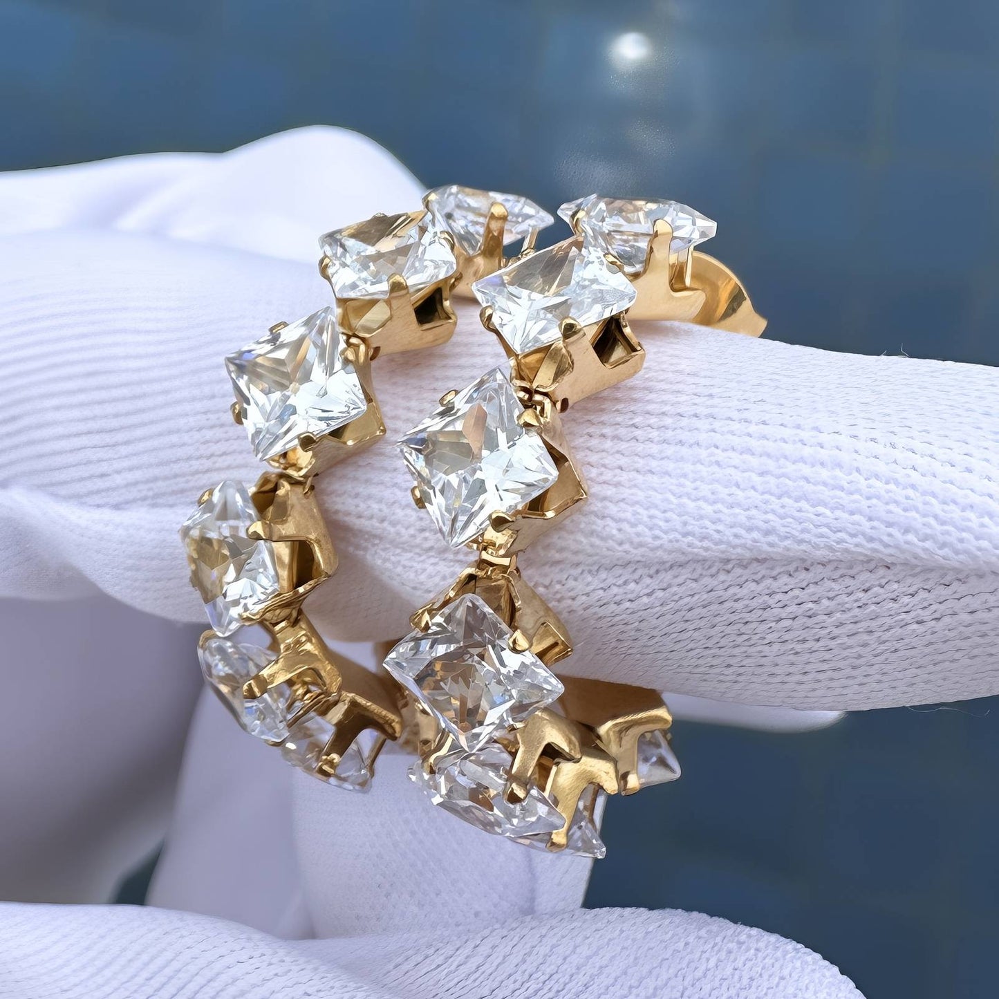 gold crystal‑embellished hoop earrings 