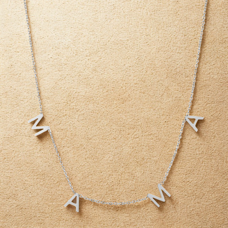 Silver mama necklace with spaced letters on a delicate chain