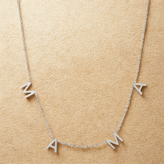 Silver mama necklace with spaced letters on a delicate chain