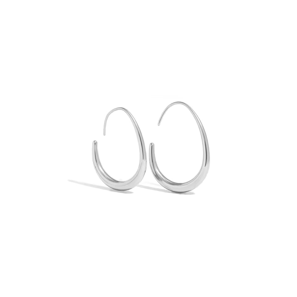 Gold open-hoop curved earrings with modern teardrop silhouette — Sway Earrings