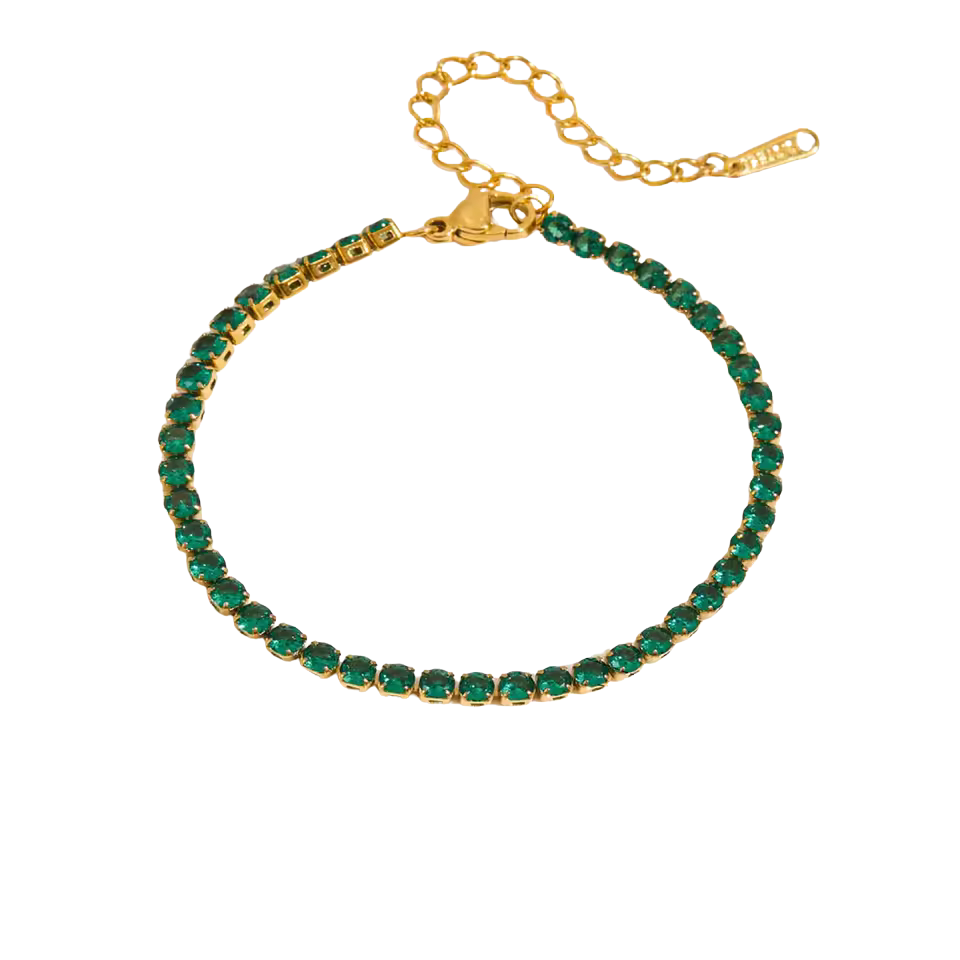 Gold bracelet with green gemstones on a white background