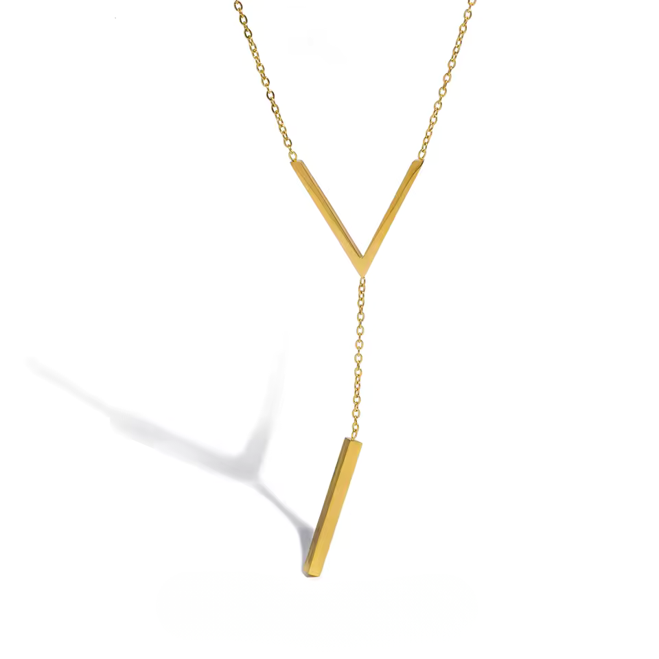 Gold necklace with a V-shaped pendant on a white background